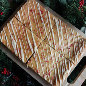 Four of our Cranberry and Orange Blondies laid on a Christmas wreath