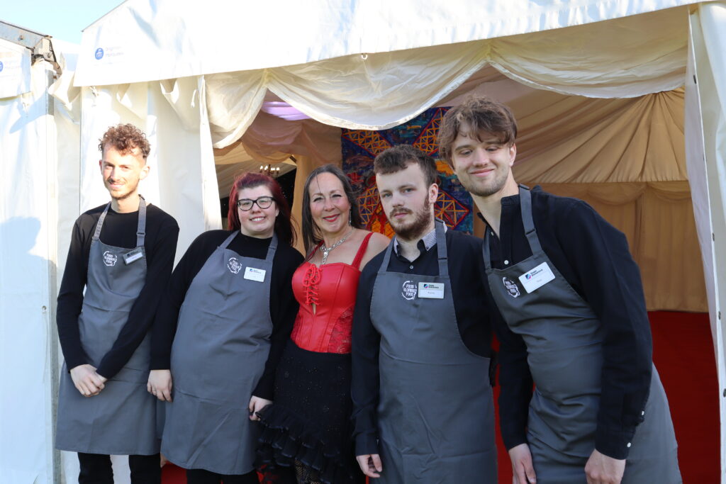 A group of people catering an event