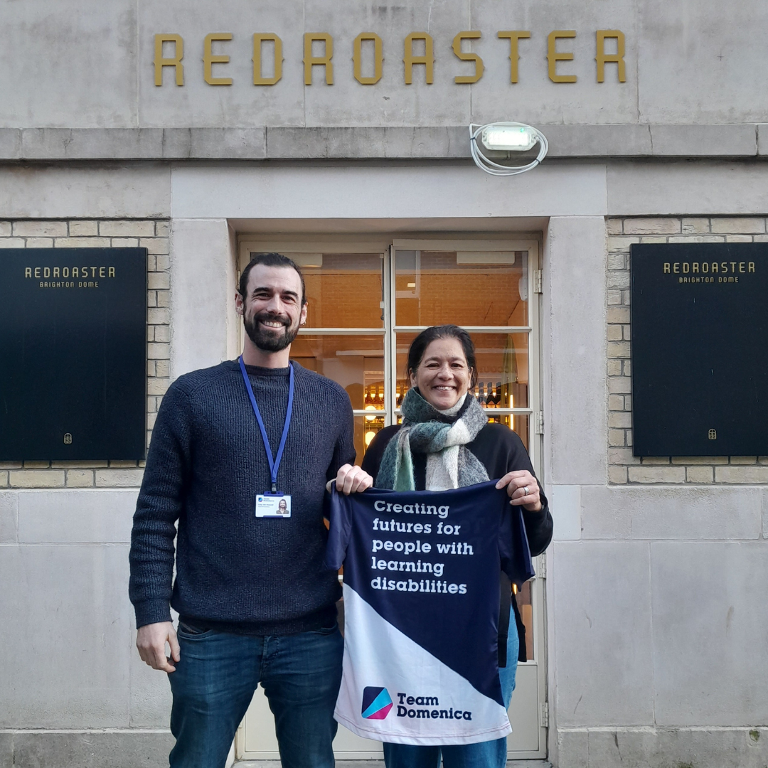 Two people stand next to each other outside of Red Roaster as we announce that they are sponsoring our running tops