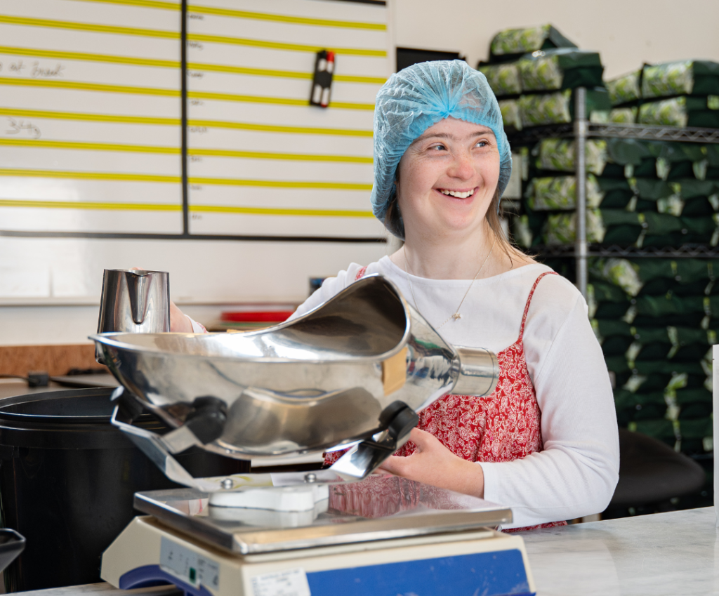 A picture of a candidate working in our coffee roastery