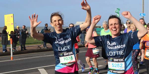 2 women running for Team Domenica at the Brighton Marathon/10km