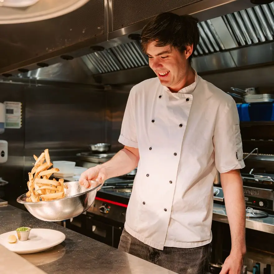 Chef at The North Star pub Brighton serving chips