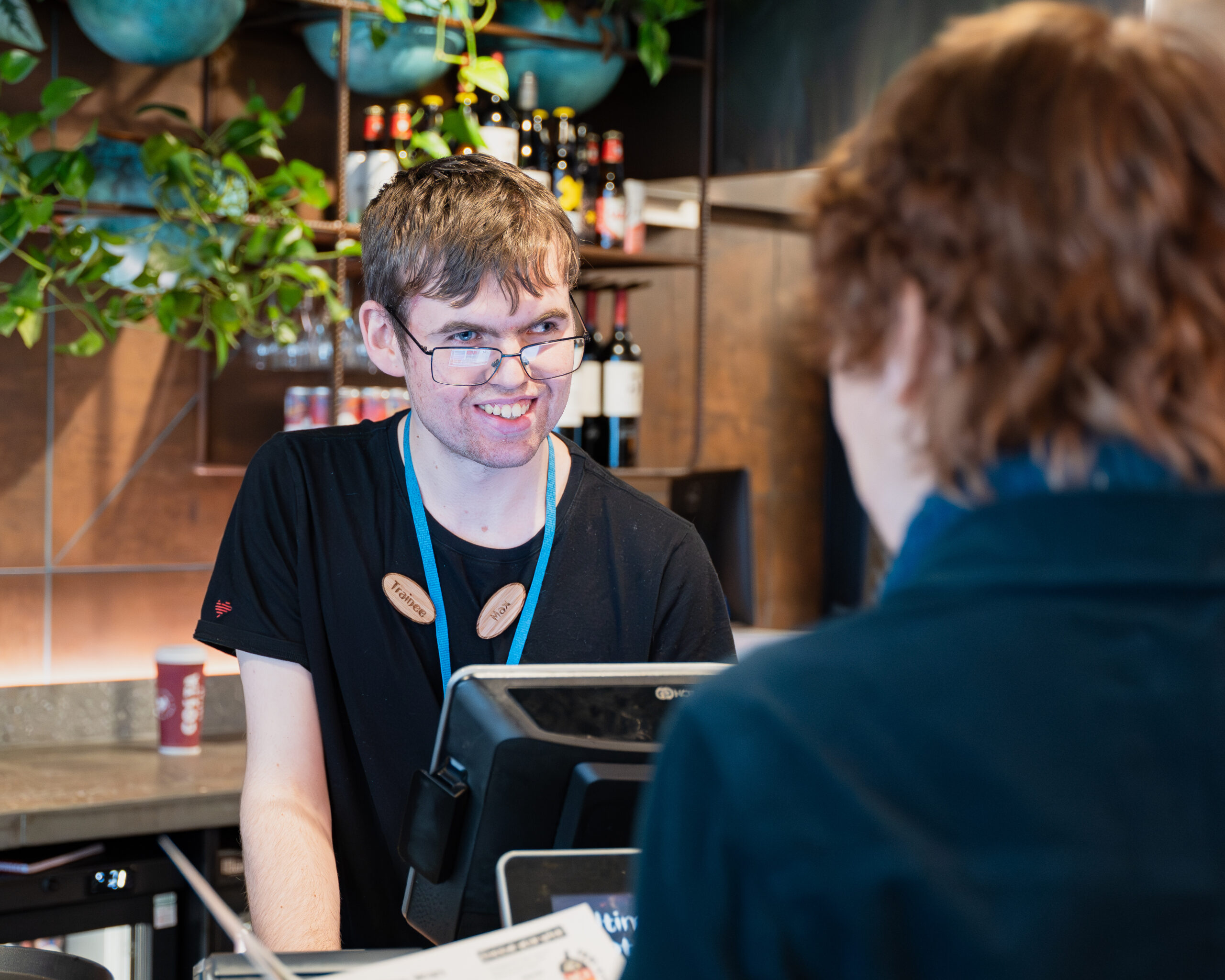 Team Domenica candidate Max serving a customer at Nando's.